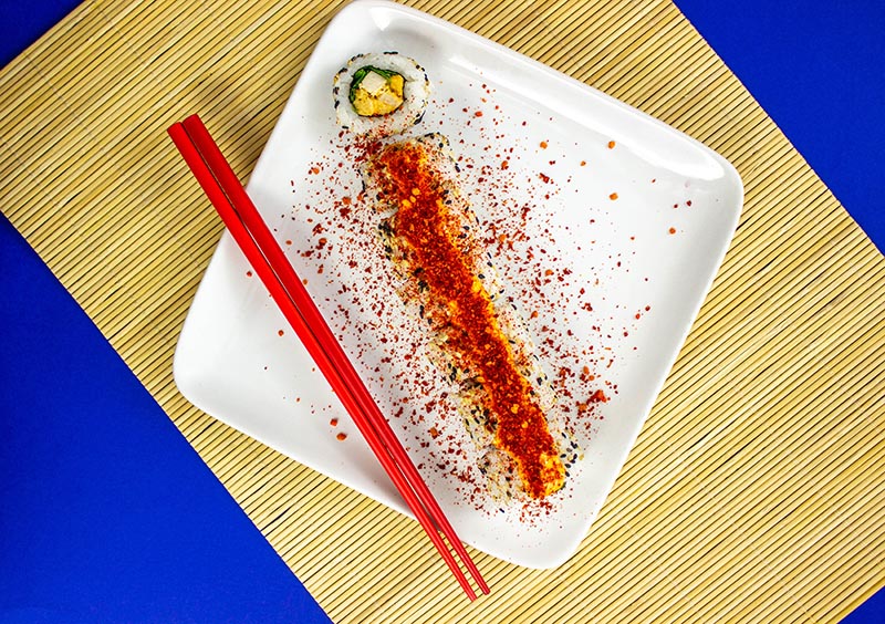 Plate of sushi on blue background