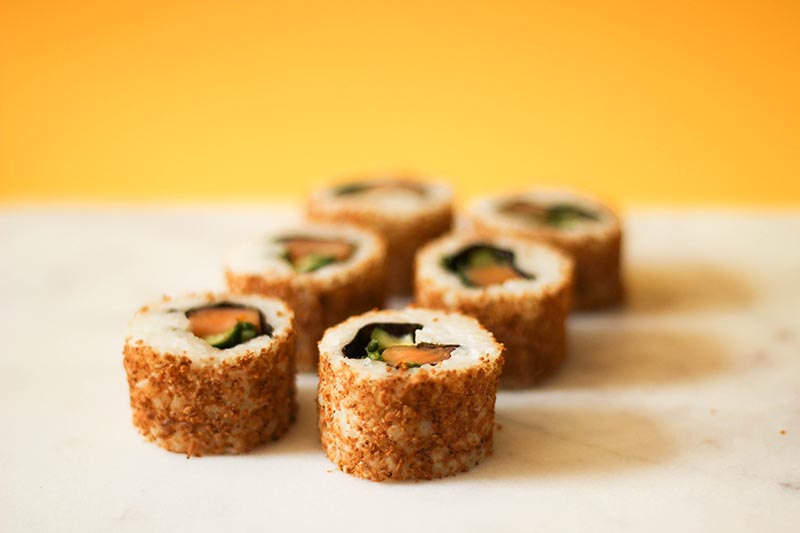 Sushi rolls on orange